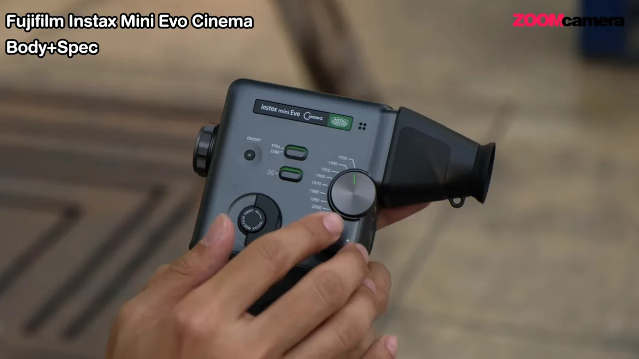 รีวิว FUJIFILM Instax mini Evo Cinema : กล้อง Hybrid ที่พาเราย้อนเวลาได้ 6 Close-up of Instax mini Evo Cinema dial and buttons with hand adjusting the dial